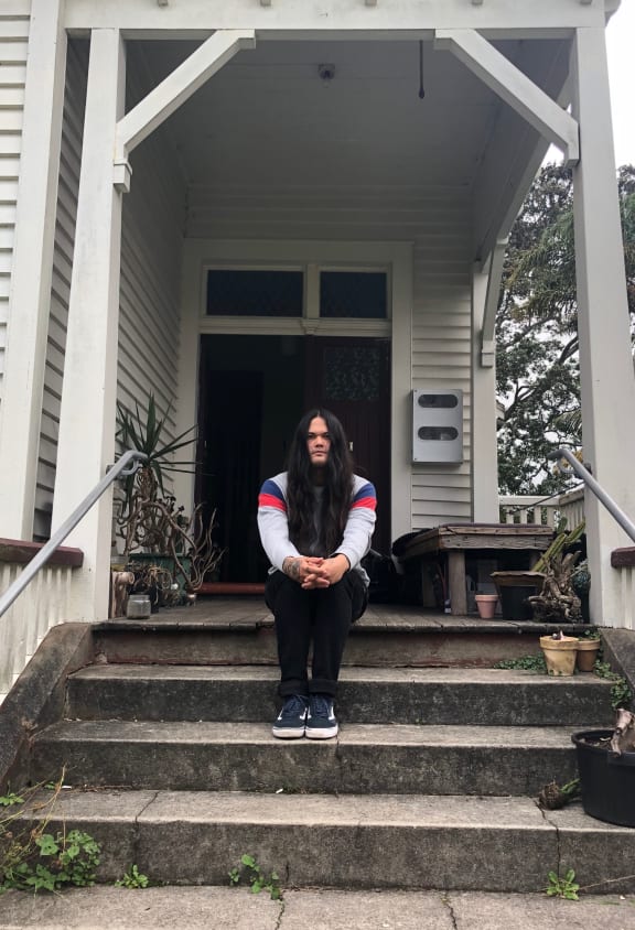 Roy Irwin outside his house in central Auckland.
