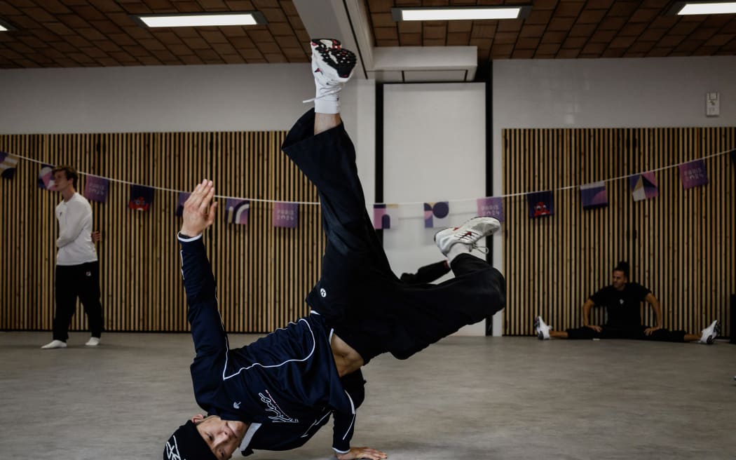 Canada's Philip Kim, known as b-boy Phil Wizard, practices during a breaking training session for the Paris 2024 Olympic Games at the Pablo Neruda sport centre in Saint-Ouen on August 6, 2024. (Photo by JEFF PACHOUD / AFP)