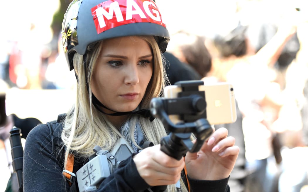 Canadian conservative and libertarian activist Lauren Southern live streams a video during a rally in Berkeley in April 2017.