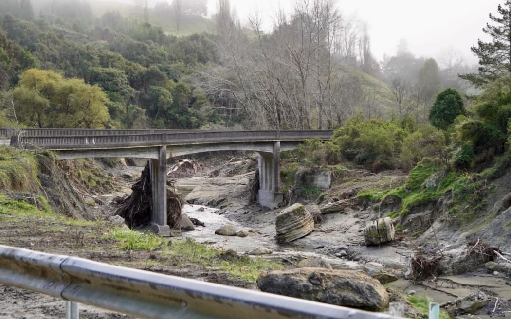 At Waikoau Bridge, huge boulders moved by the floodwater, with slash still built up