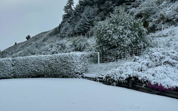 Snow to a depth of three inches is seen on dairy farmer Robert Durling's property in Athol, Southland on 27 October, 2023.