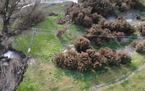 A downed power pole on Pig Saddle Road, near Sheffield in Selwyn District, filmed by a drone.
