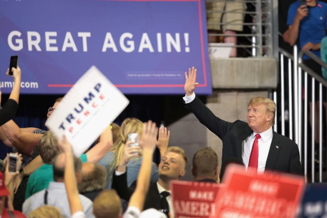 US President Donald Trump greets supporters after speaking during a campaign rally  on June 20, 2018 in Minnesota.
