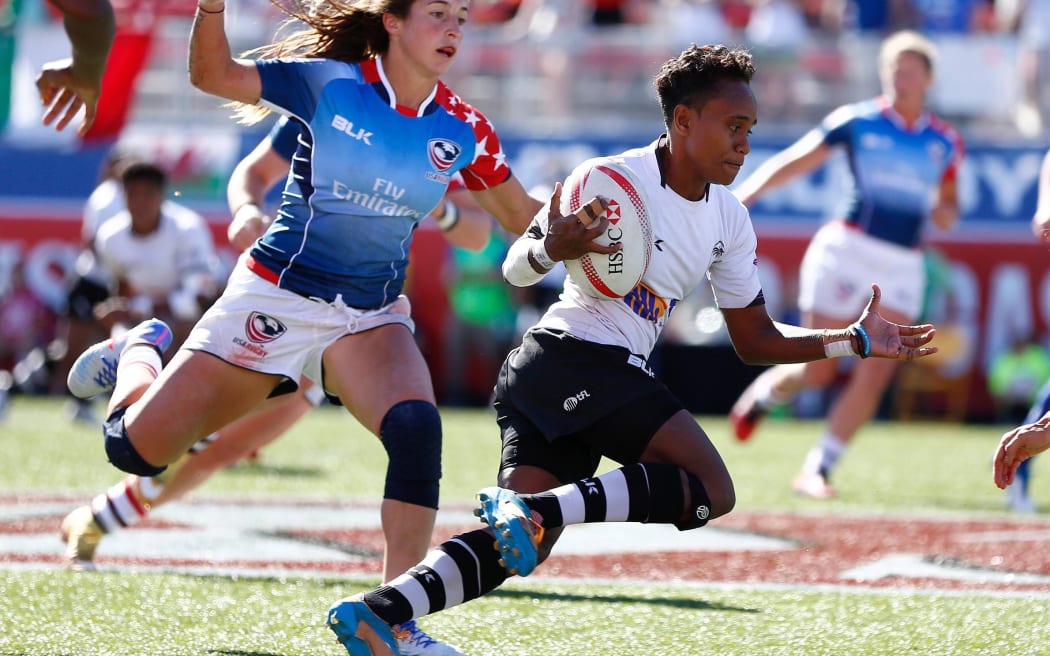 Fiji's Tima Ravisa cuts through the USA defense at the Las Vegas Sevens