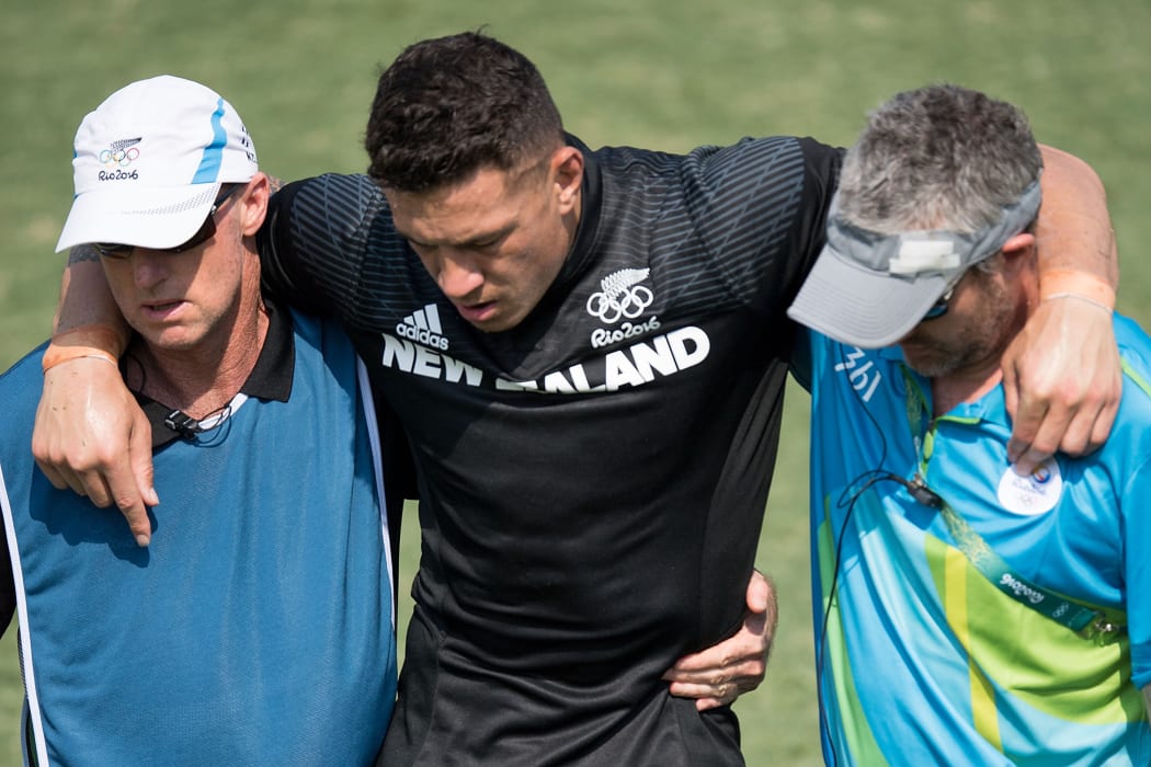 Sonny Bill Williams is helped from the field after damaging his Achilles tendon during New Zealand's loss to Japan.