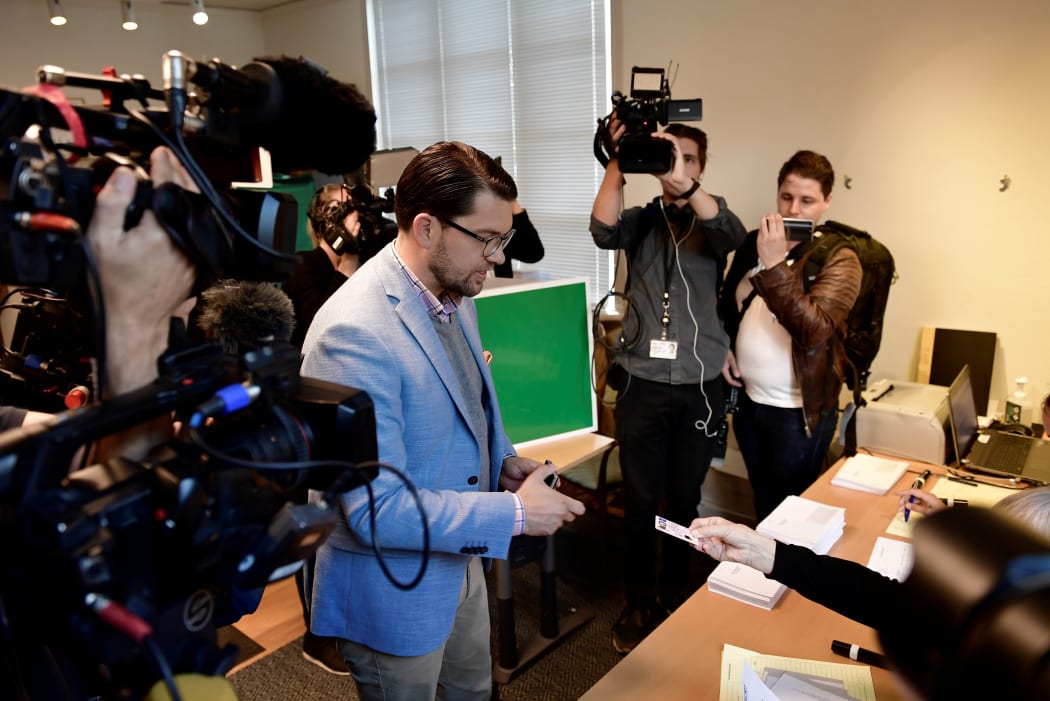 Jimmie Akesson, leader of the right-wing nationalist Sweden Democrats party, votes in the Swedish general elections at a polling station in Stockholm.