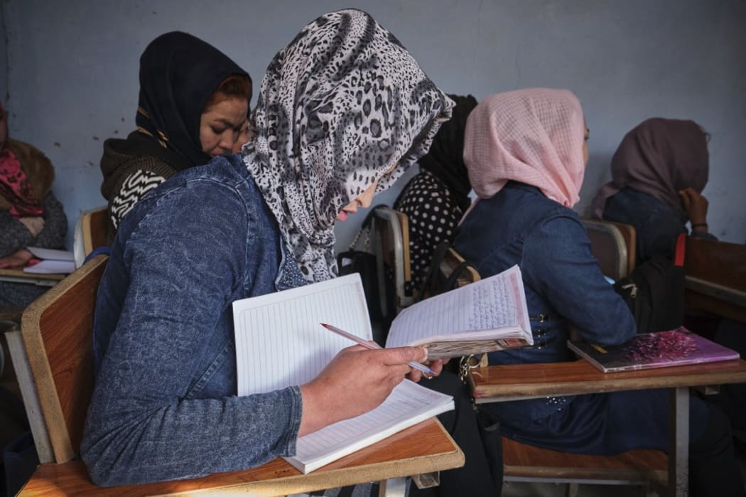Afghanistan, 2019-11-02. A group of Afghan teenage girls take notes during a class. Photograph by Guillaume Pinon / Hans Lucas.
Afghanistan, 2019-11-02.