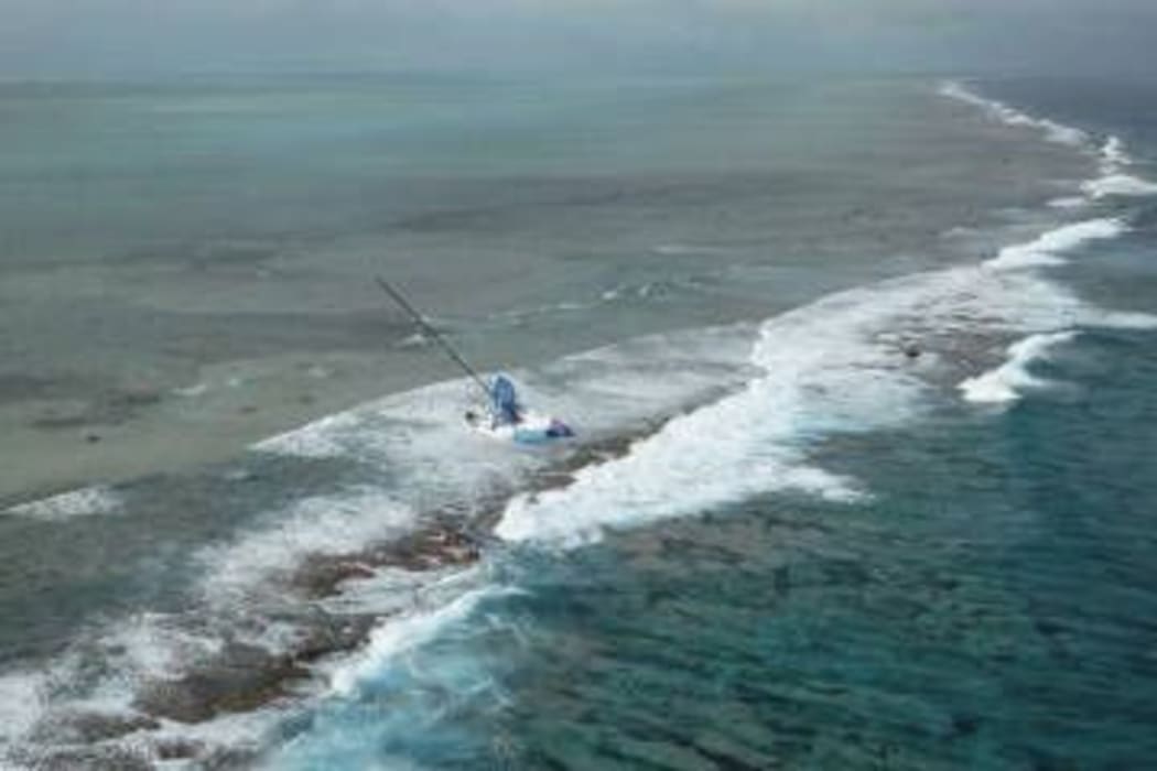 Team Vestas Wind a competitor in the Volvo Ocean race lies on a reef in the India Ocean.