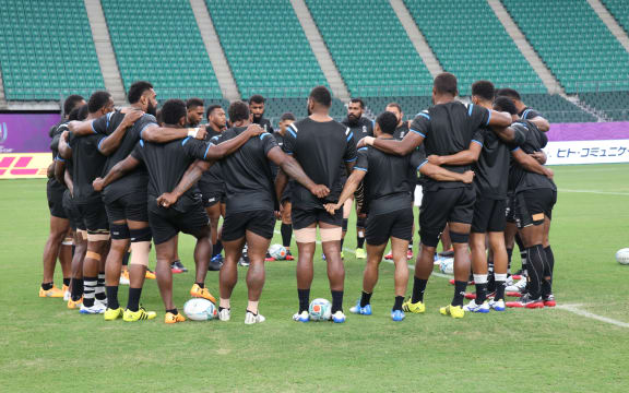 Fiji huddle together during their captain's run in Oita.