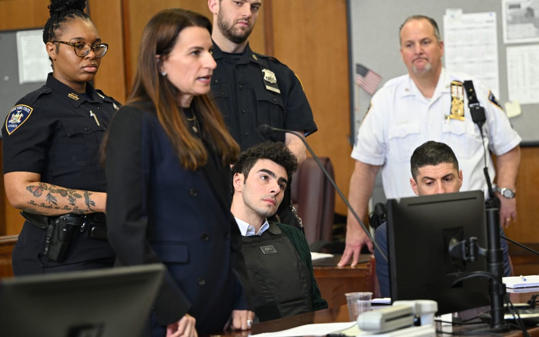 Luigi Mangione listens to his attorney Karen Friedman Agnifilo at a hearing in Manhattan Criminal Court on February 21.