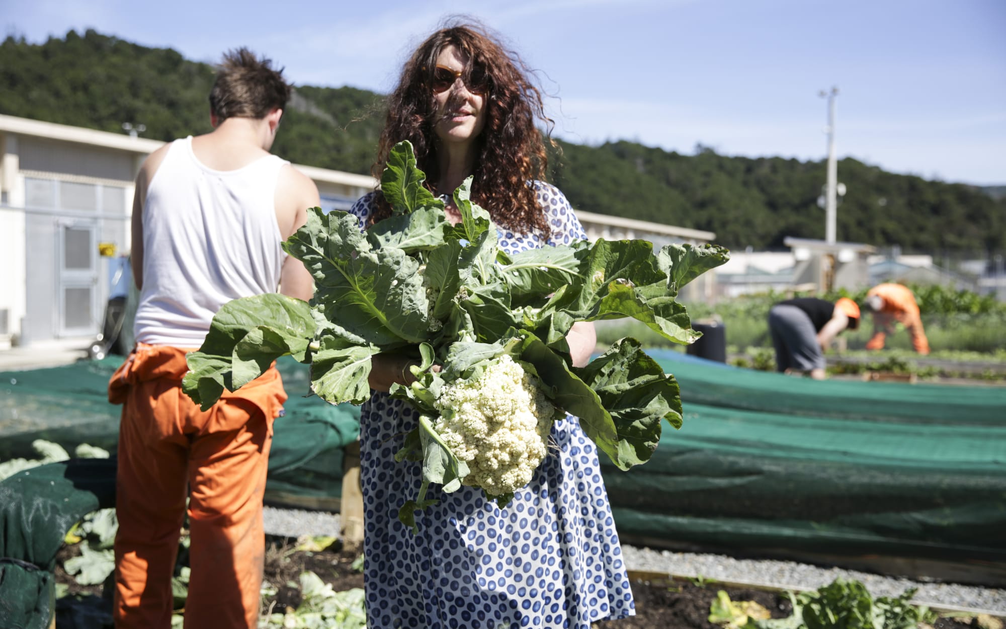 Julia Milne, from Common Unity, collects vegetables from Rimutaka Prison.