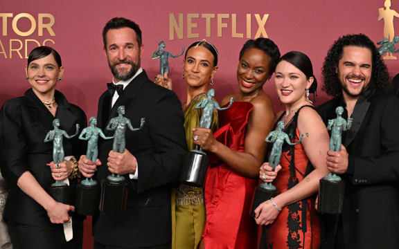 US actor Noah Wyle (2L) holds the award for Outstanding Performance by a Male Actor in a Drama Series with the rest ot the cast winners of Outstanding Performance by an Ensemble in a Drama Series "The Pitt" during the 32nd Annual Actor Awards at the Shrine Auditorium in Los Angeles on March 1, 2026. (Photo by Frederic J. Brown / AFP)