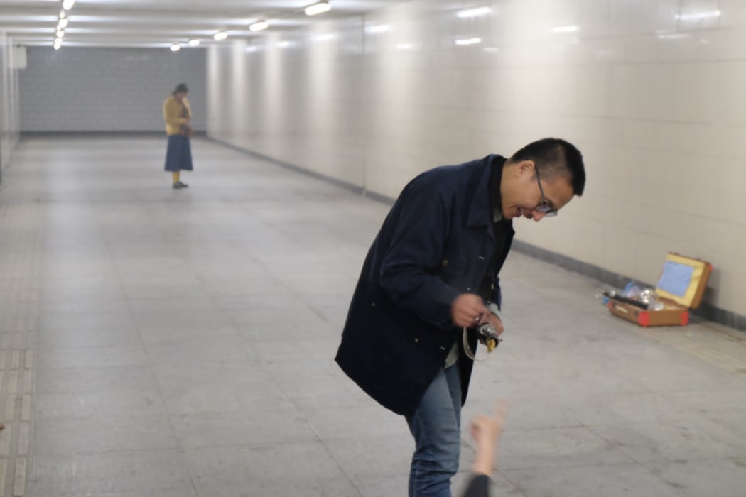 Ake and Zhu Wenbo jamming in the underpass, Beijing.