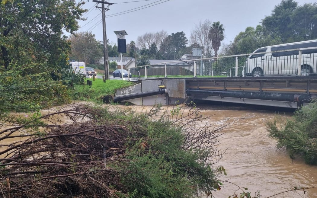Swanson Stream in Henderson, Auckland running at a high level after heavy rain on 9 May 2023.