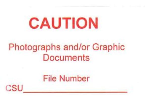A warning label like this one was fixed to the front of a plastic envelope, and inside was the sheet saying: ‘No Photographs …’ and the pictures.