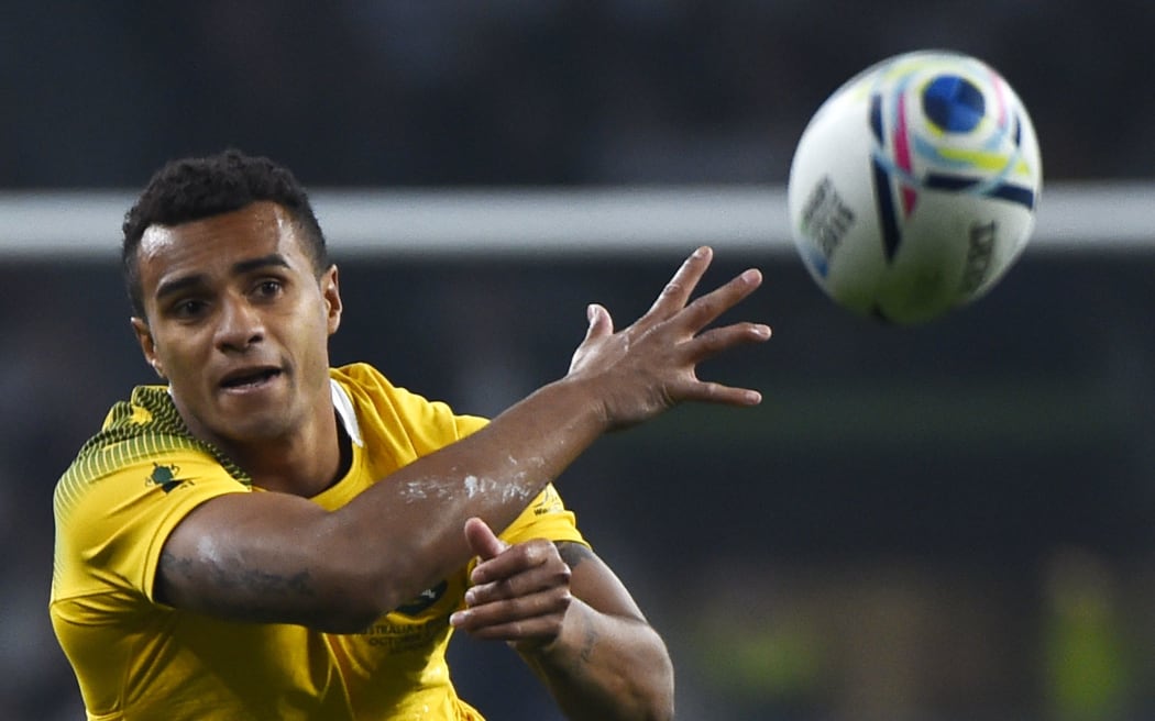 Australia's scrum half Will Genia passes the ball during a Pool A match of the 2015 Rugby World Cup between England and Australia at Twickenham stadium, south west London, on October 3, 2015