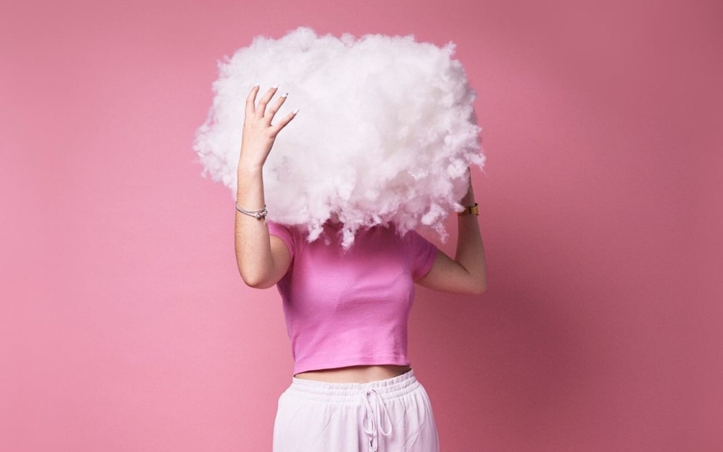 Person in pink tee shirt with a cloud in place of their head