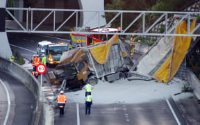 The truck and trailer unit plunged through a barrier at at Spaghetti Junction on the Southern Motorway.