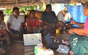 Lab technologists in Kiribati training nurses on an outer island to perform pap smear tests.