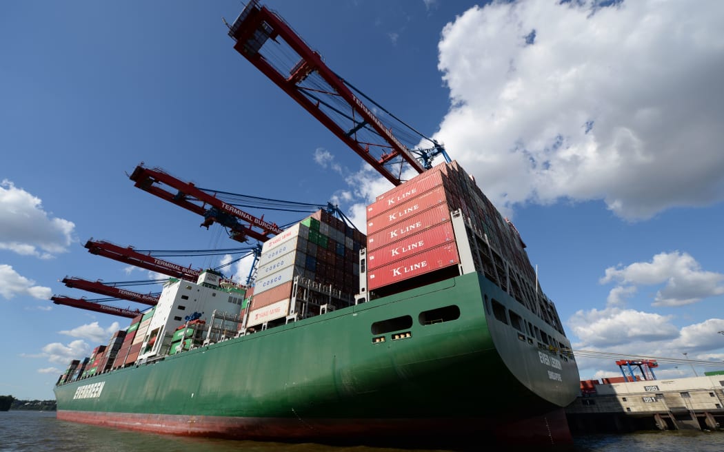 Container ship Ever Legion docks at the port of Hamburg.