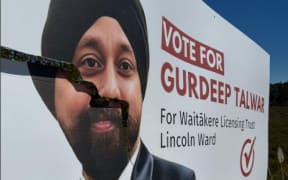 Damaged billboards of Gurdeep Talwar, contesting the Waitākere Licensing Trust’s Lincoln ward seat as an independent