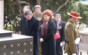 Minister Maggie Barry and Attorney-General Chris Finlayson pay their respects at the tomb of the unknown warrior.