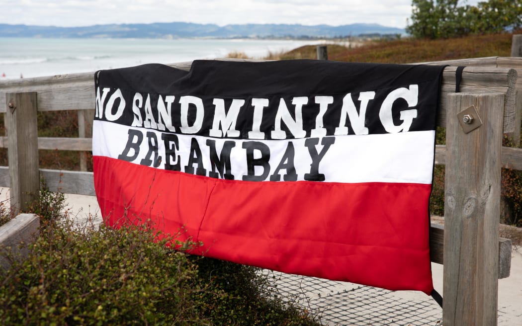 No Sand Mining Bream Bay protest banner hangs at Ruakaka Beach