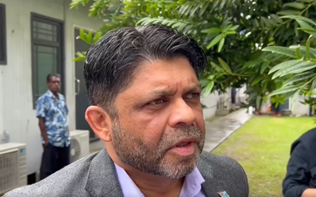 Aiyaz Sayed-Khaiyum speaking to journalists outside a Suva court on 13 June 2023.