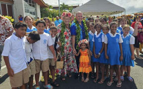 Prime Minister Mark Brown poses with students from Apii St Josephs who were involved in the festivities.