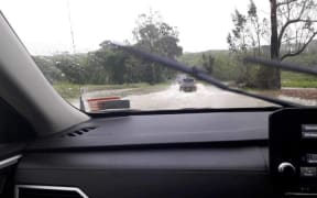 A truck tackles floodwaters on State Highway 35, which has since closed. "Rototahi is now flooded and not passable. Waka Kotahi will be closing SH35 until flooding recedes", warns Uawa Civil Defence.