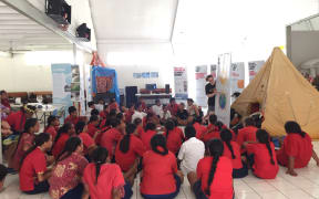 Children in Rarotonga hear about climate change.