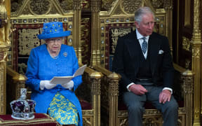 The Queen sits alongsides Prince Charles as she delivers the Queen's Speech.