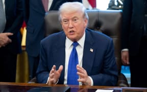 US President Donald Trump speaks to the press about a critical minerals stockpile with $12 billion in initial funding, as Washington seeks to lower reliance on China for rare earths and other resources, in the Oval Office of the White House in Washington, DC, on February 2, 2026. (Photo by SAUL LOEB / AFP)