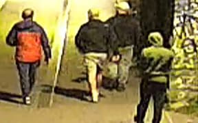 This handout image of CCTV footage released by Avon and Somerset Police on 11 December, 2025 shows men carrying bags in the early hours of 25 September in the city of Bristol, south-west England outside a building which housed items from the Bristol Museum’s British Empire and Commonwealth collection.