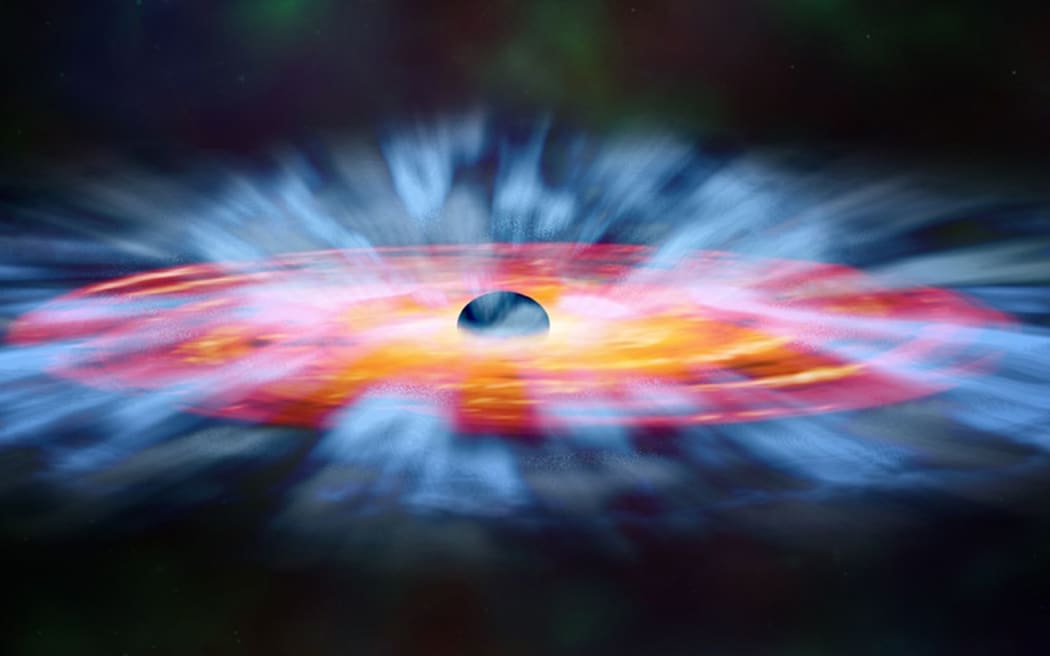 A NASA artist's illustration of the turbulent winds of gas that swirl around a black hole.