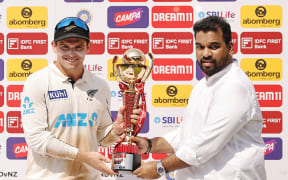 Tom Latham (c) of New Zealand with Champions Trophy during day 3 of the 3rd Test Match between India and New Zealand held at the Wankhede Stadium.

Photo by Saikat Das / Sportzpics for BCCI