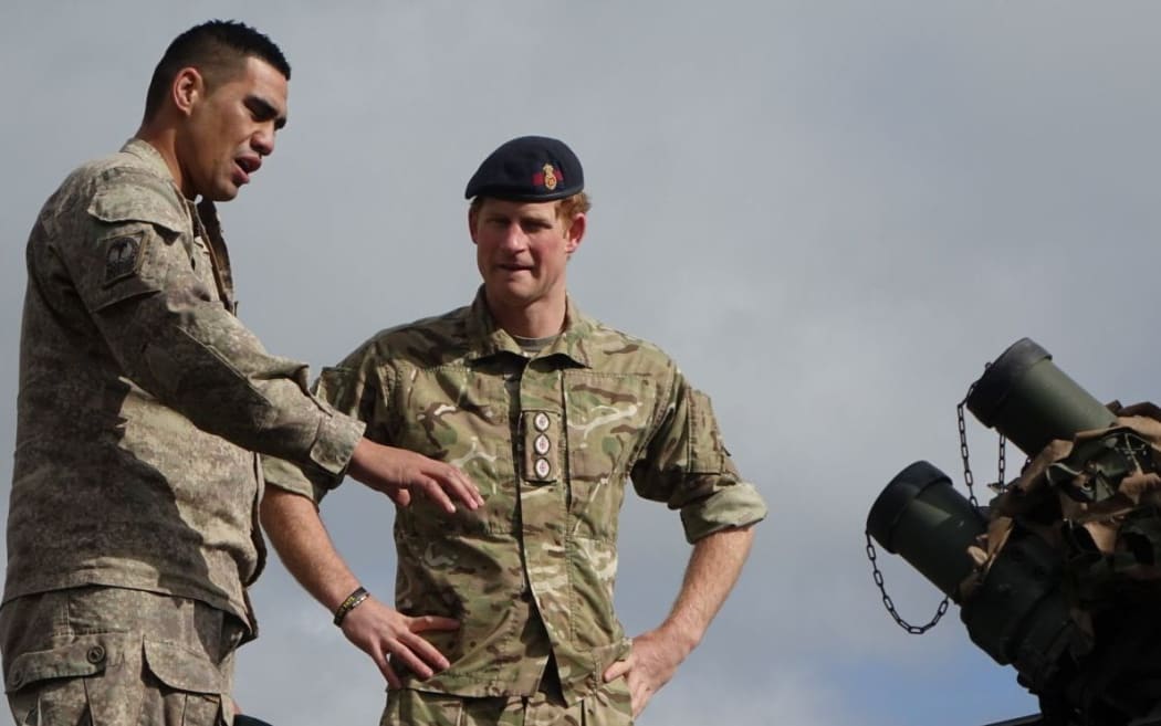 Corporal Poi talks Prince Harry through the intricacies of a LAV before taking him for a spin.