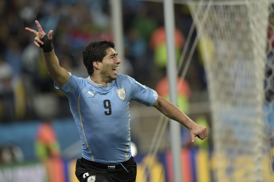 Uruguay's forward Luis Suarez scored both goals at Corinthians Arena in Sao Paulo.