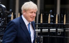 Boris Johnson leaves Conservative party headquarters in central London after party members voted him next Tory leader and UK prime minister.