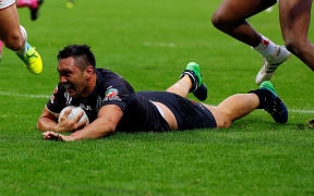 Jordan Rapana scores for the Kiwis against  England.