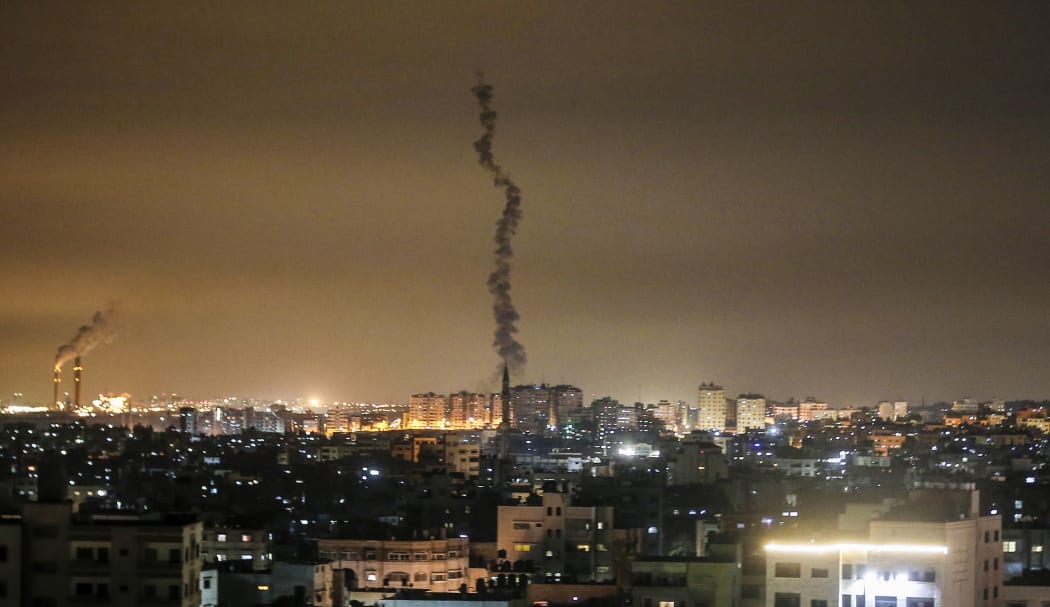 A picture taken on February 23, 2020, shows the smoke trail of a rocket, fired by Palestinian militants, flying over the Gaza Strip.