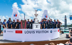 Team New Zealand on stage to be presented with the America's Cup