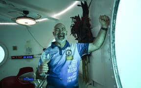 German aerospace engineer Rudiger Koch, 59, celebrates after breaking the Guinness world record for living in the ocean at a depth of eleven meters off the coast of Puerto Lindo, Panama, on January 24, 2025. (Photo by MARTIN BERNETTI / AFP)