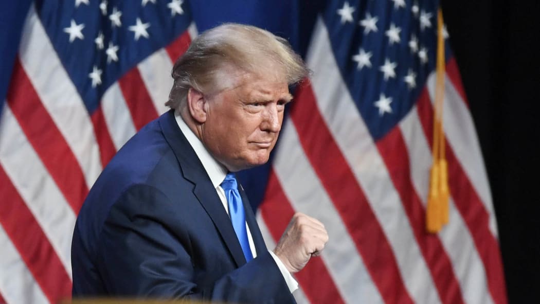 US President Donald Trump waves to the crowd on the first day of the Republican National Convention at the Charlotte Convention Center on August 24, 2020.   David T. Foster III-Pool/Getty Images/AFP