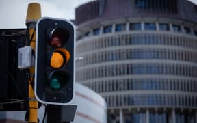 Orange Traffic Light in front of Parliament