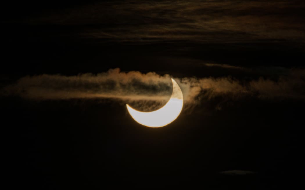 Cloud floats across the sun during the partial solar eclipse on Monday morning.