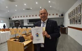 Cook Islands Prime Minister Mark Brown holds the 2023/24 Budget with the theme 'Nurturing our Nation'