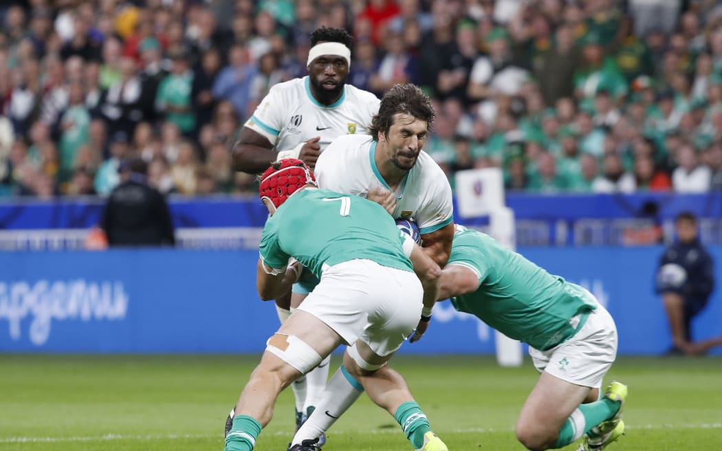 South African Eben Etzebeth is tackled by Irish players