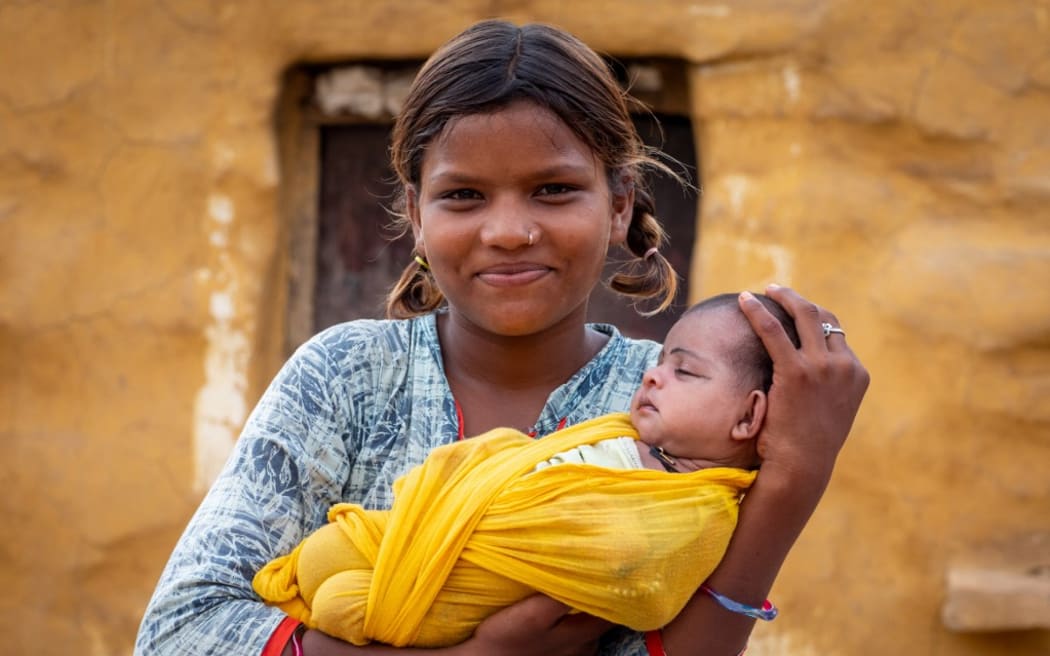 Young rajasthani mother with her baby, Rajasthan, Jaisalmer, India. (Photo by Eric Lafforgue / Hans Lucas / Hans Lucas via AFP)