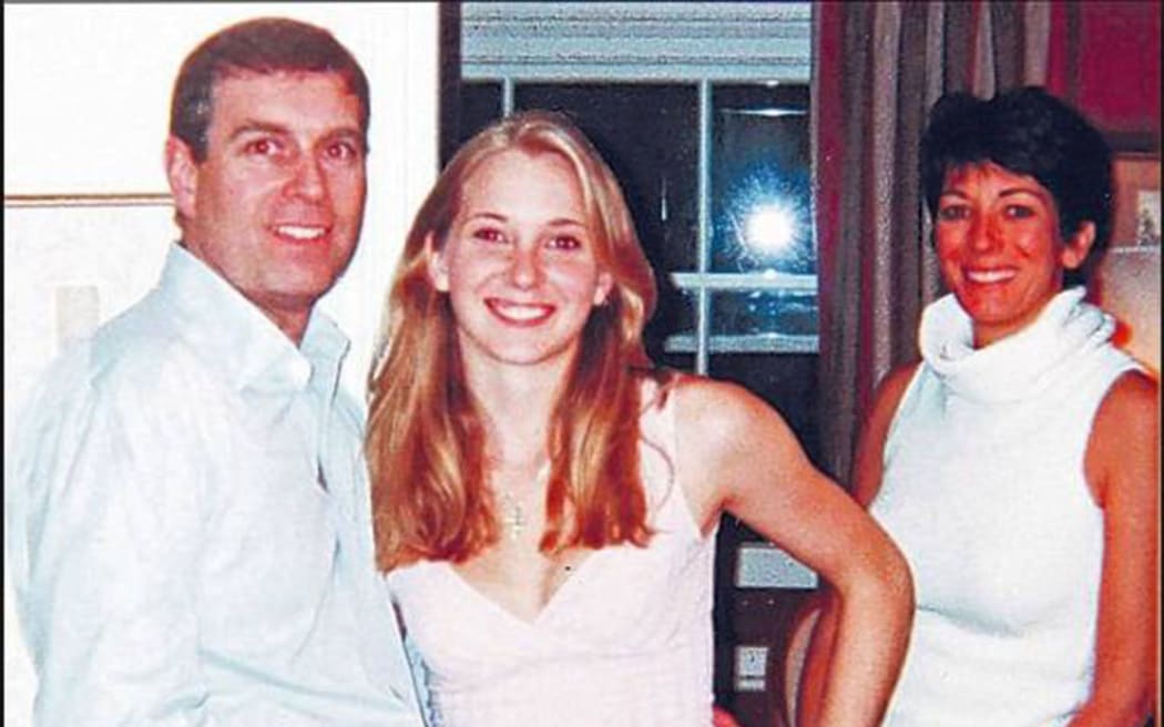 A photograph appearing to show Prince Andrew with Jeffrey Epstein's accuser Virginia Roberts Giuffre and Ghislaine Maxwell.